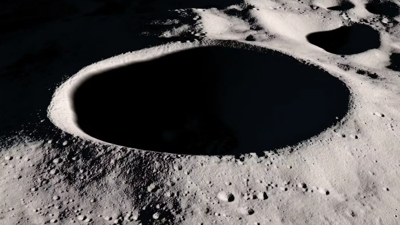 a picture of moon crater with big black hole at it center. the